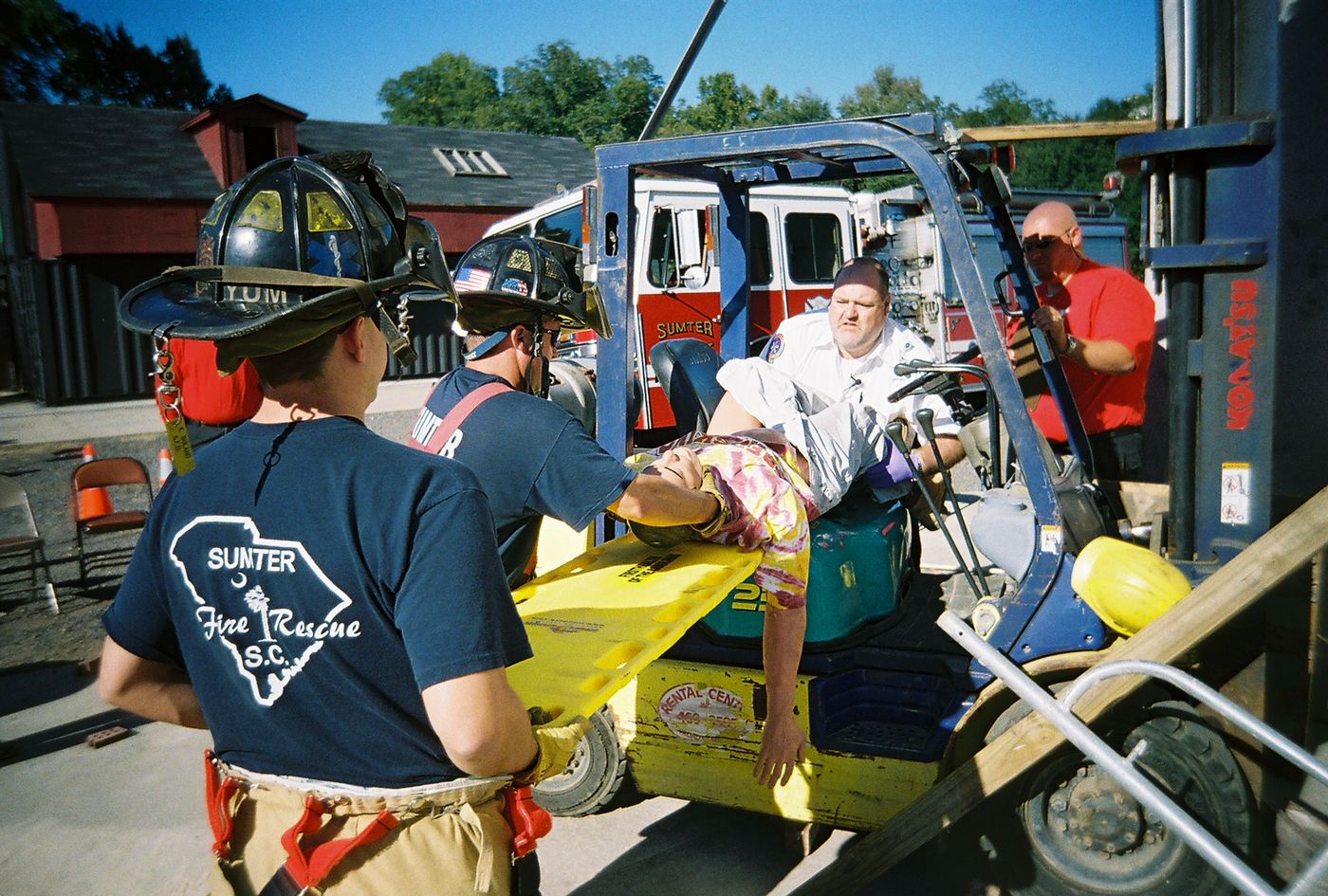 A team moving a patient from a forklift onto a backboard in Sumter, 2006