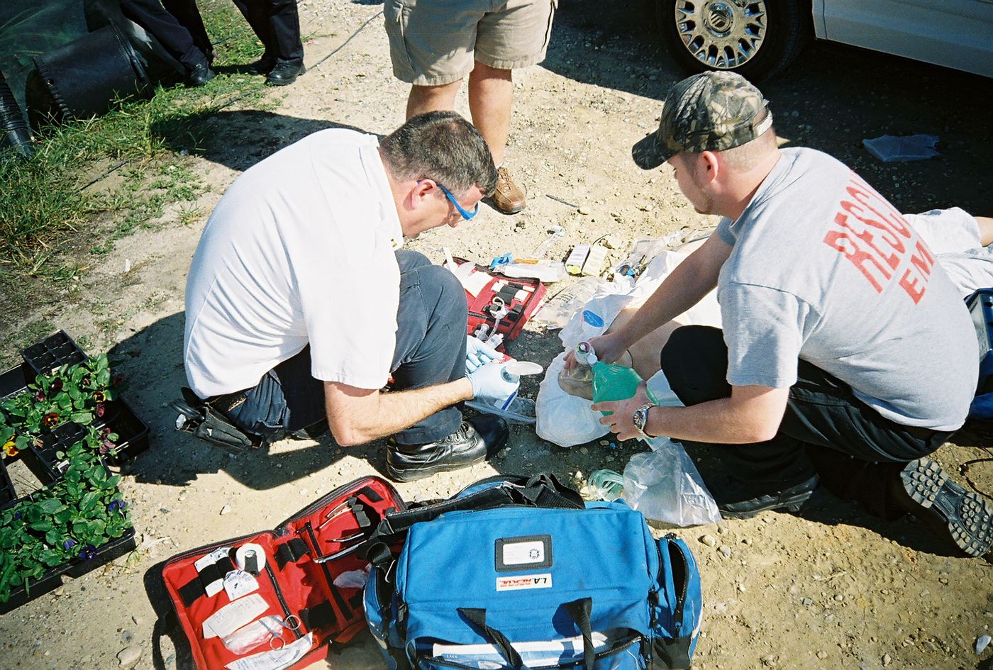 Two medics working a patient on the ground in Dunn, 2007